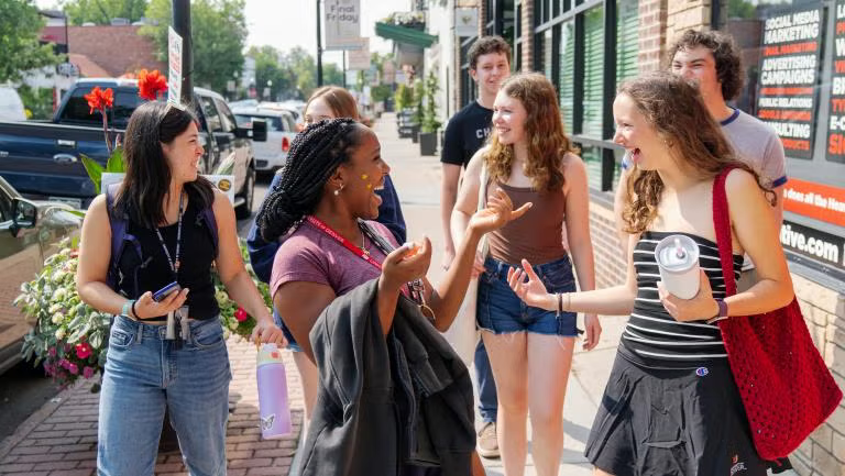 a group of students walking on a street
