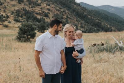 Madeline with her spouse and baby