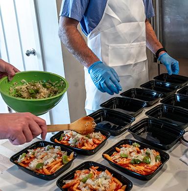 Meals are packaged into single use containers.